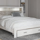 Altyra King Upholstered Bookcase Bed with Storage