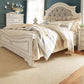 Realyn Queen Upholstered Panel Bed